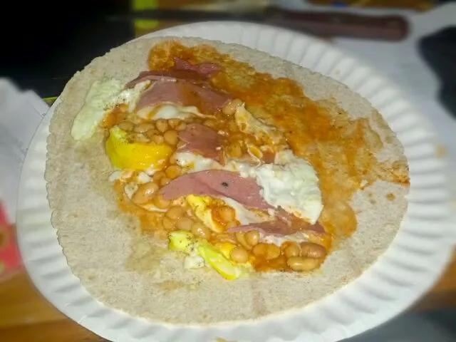 eggs baked beans and beef slices on tortilla breal|Muhammad Ba Atwahさん