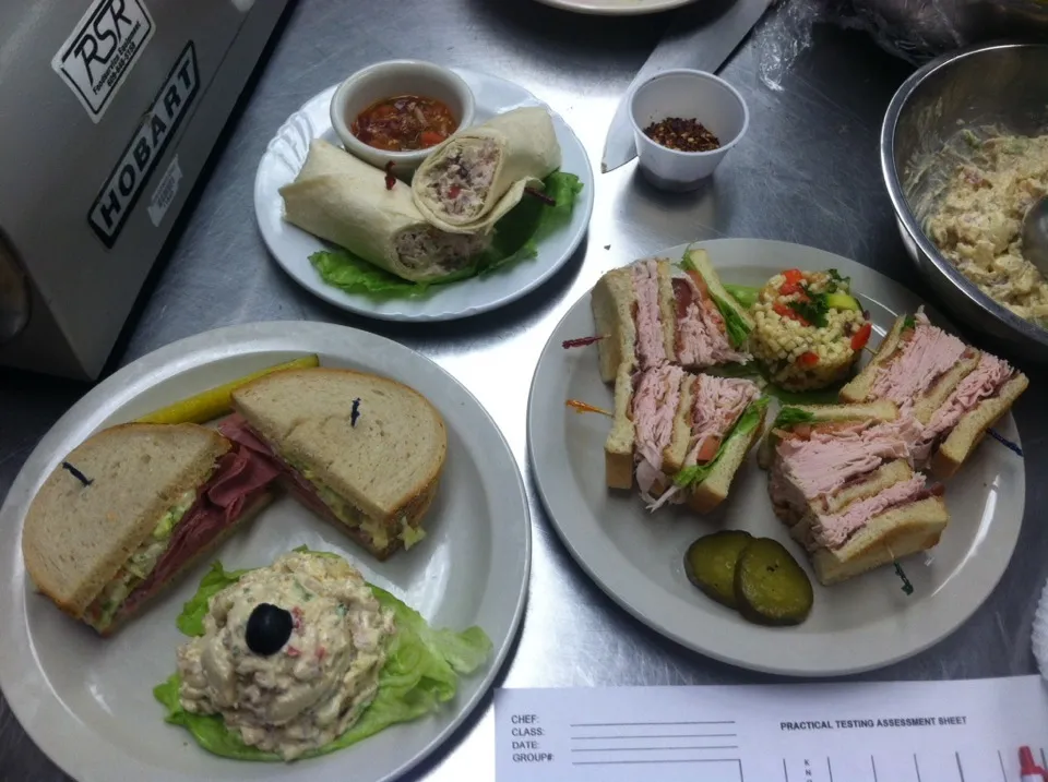 School presentation chicken salad with grapes and dried tarragon, traditional corned beef with homemade Russian dressing, and turkey club with spicy mayo sides |Jennifer Ciminoさん