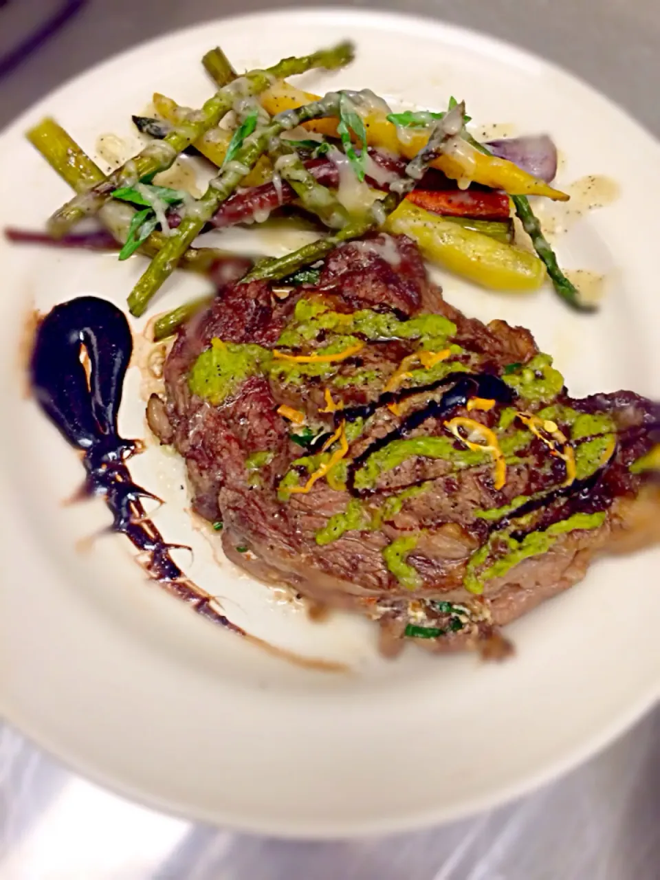 Goat Cheese and sautéed mushroom stuffed Ribeye with asparagus purée with a side of Rainbow carrots and wine reduction sauce|kirby gholsonさん