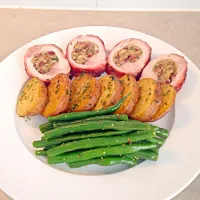 Smoked bacon rolled pork loin stuffed with sage onion cranberry and hazelnut, herb and garlic sautéed potatoes with mustard green beans