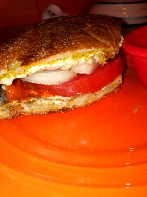 Snapdishの料理写真:Panini with onion, tomato, chili pepper spread, vegan mozzarella, and marinated baby Bella.|Polly Gelfusoさん