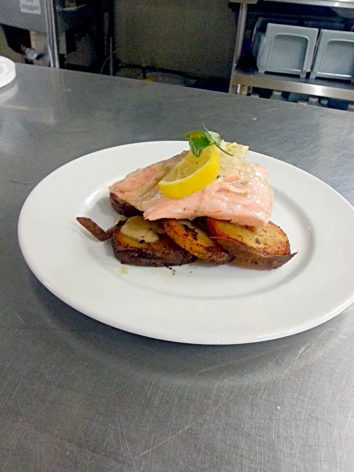 poached Atlantic salmon with cajun cream sauce and blackened potato medallions|Jayson Mccrimmonさん