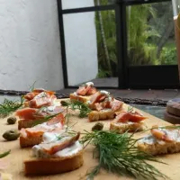 Snapdishの料理写真:Home Smoked & Cured Salmon Crostini with caper dill aioli|Austin McKennaさん