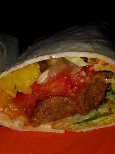 Soysauge wrap with Boston lettuce, tomato, pickle, hots, red pepper spread, and mayo.|Polly Gelfusoさん