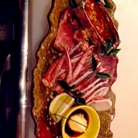 Snapdishの料理写真:スルメイカの姿焼きわた醤油を添えて|Taketomo Ishiharaさん