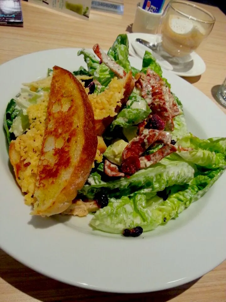 Grilled Chicken Cos Lettuce Salad with cranberries, avocado, turkey bacon in Ranch dressing by delicious.|Dianne Ponさん