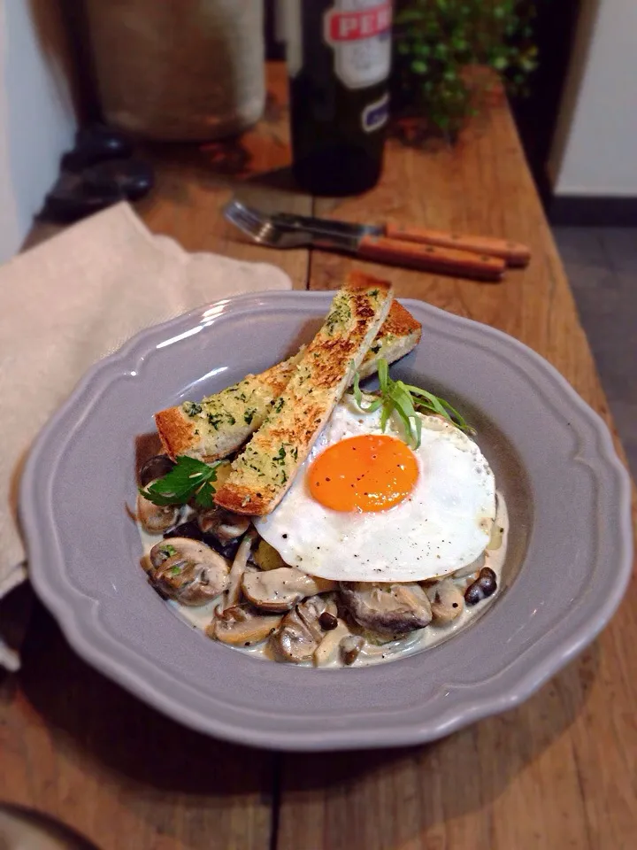 Mushrooms with cream and tarragon,fried duck egg,homemade garlic breadstick.|rick chanさん