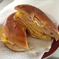 Snapdishの料理写真:A simple ham and cheese omelette in a bagel then toast the sandwich|Jorge Riveraさん