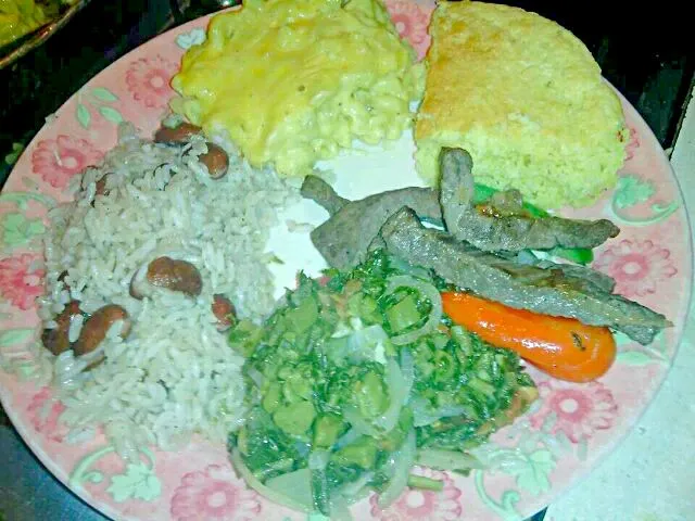 Snapdishの料理写真:Pepper steak, rice and peas, baked Mac, corn bread and callaloo|Kristen Hatfieldさん