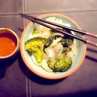 Steamed veggies on a bed of wet rice with spicy peanut satay sauce|elisha odegardさん