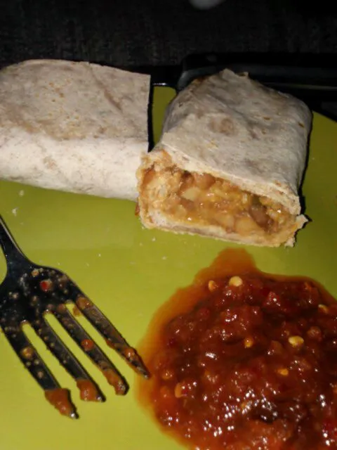 Amy's breakfast burrito. With ketchup and chili paste.|Polly Gelfusoさん