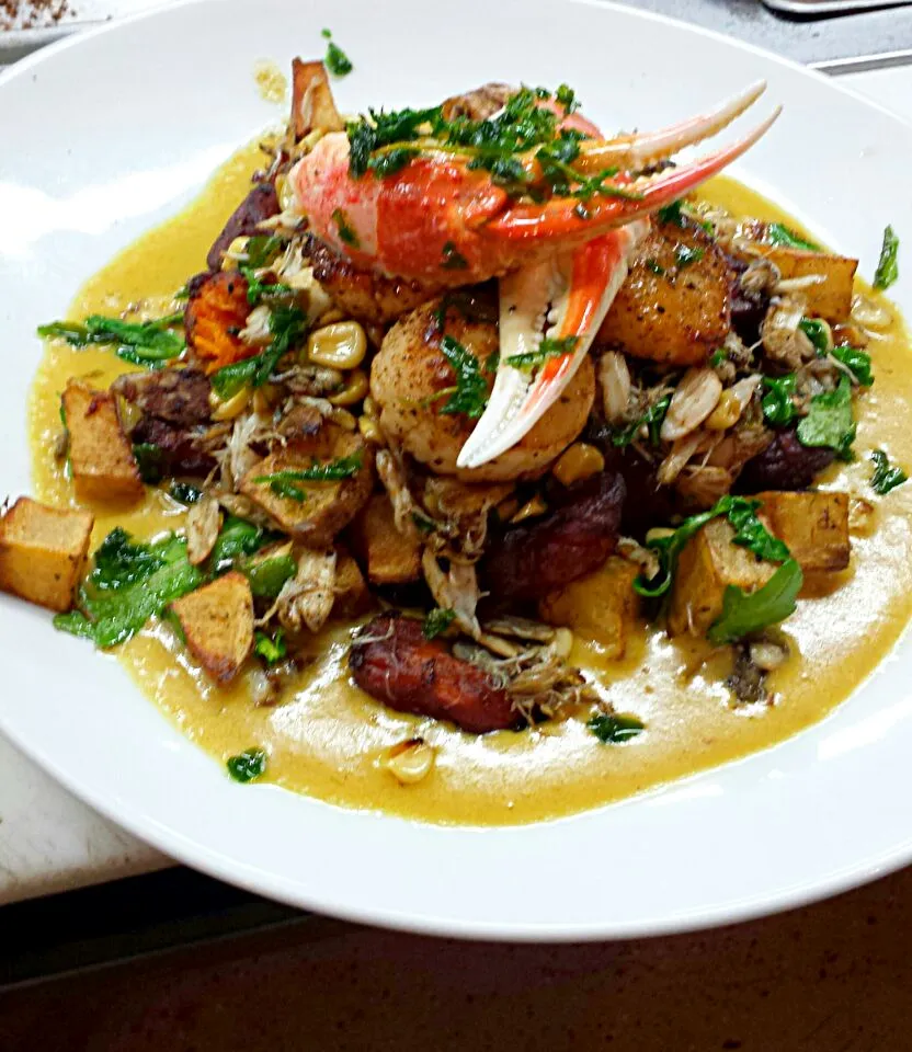 a seafood journey. crab, scallops,  lobster setting on a bed of corn greens and roasted potatoes :)|Steven Doportoさん