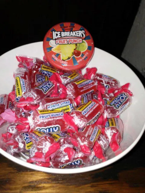 My candy bowl. Jolly rancher awesome reds (cherry, watermelon, strawberry, and fruit punch!), and ice breakers fruit punch bites.|Polly Gelfusoさん