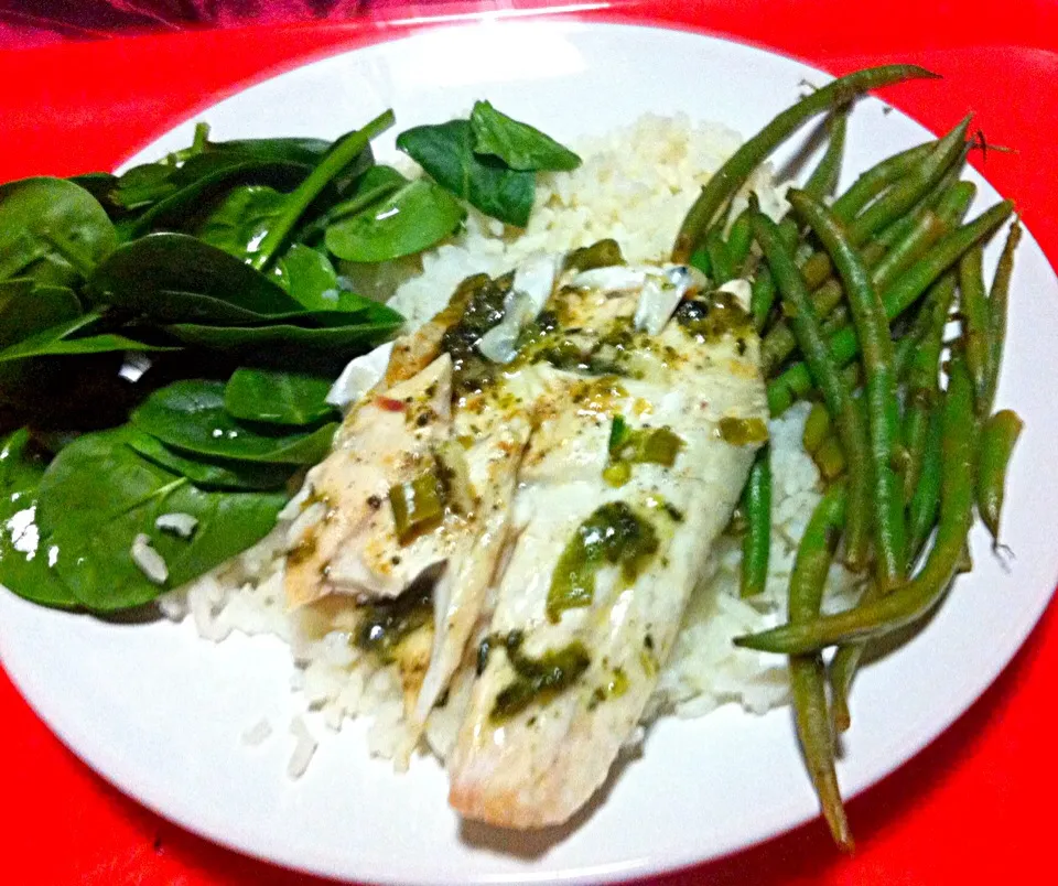 Baked sea bass with chilli, garlic, corriander, lemon & lime. Served with rice, spinach and seasoned chilli green beans|Nicole Avisさん