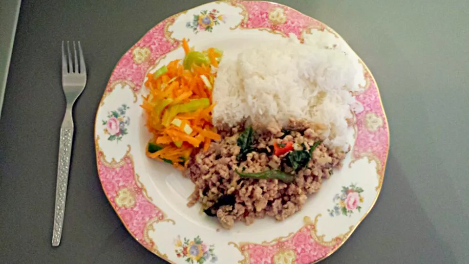 Snapdishの料理写真:minced pork with crispy basil and chilli,  served with carrot and celery salad and rice.|chandu patilさん