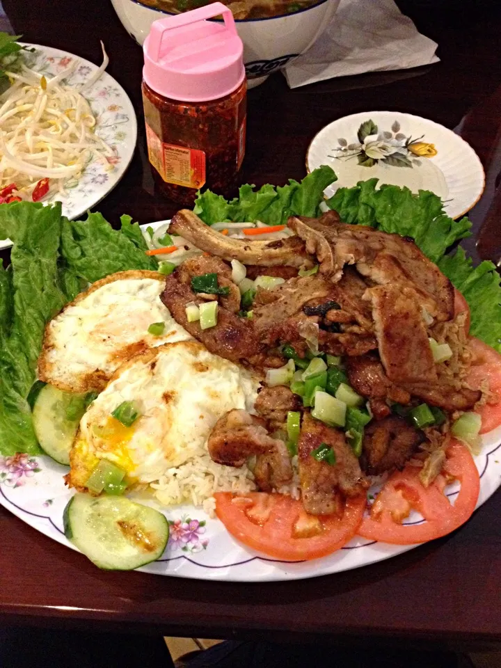 Snapdishの料理写真:Com Suon- rice with pork chops and eggs, at Bac Lieu Restaurant. Sometimes, you just want that hole-in-the-wall that serves comfort food that warms you to the b|Emmie Pizarroさん