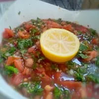 Snapdishの料理写真:Salades coriande tomatoes garlic red vinaigre and lemon|Tiffany Maiteeさん