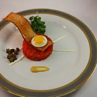 Snapdishの料理写真:Dehydrated Tomato Tartare W/ Sunnyside Quail Egg, Fried Capers, Creme Fraiche, Toasted Crostini and Mustard|Chef_RLさん