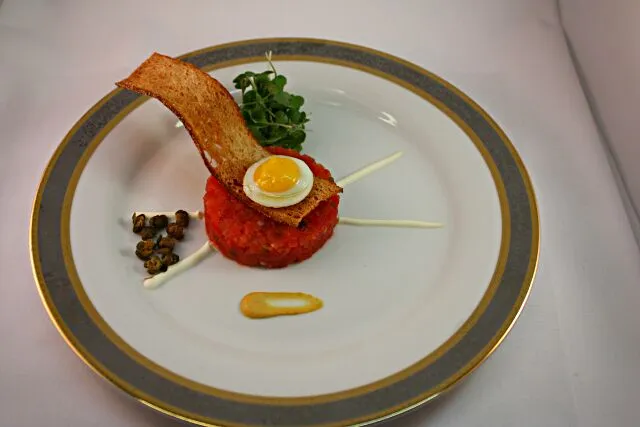 Dehydrated Tomato Tartare W/ Sunnyside Quail Egg, Fried Capers, Creme Fraiche, Toasted Crostini and Mustard|Chef_RLさん