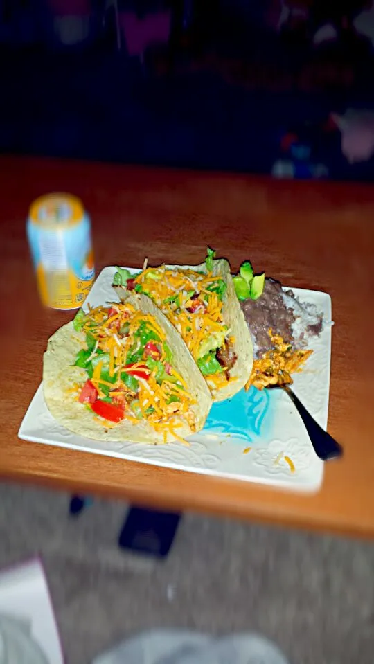 Snapdishの料理写真:chicken tacos toppef with a cilantro and lime aioli, lettuce, tomatoe, and avacado. With a side of jasmine rice topped with black refried beans|Marceloさん