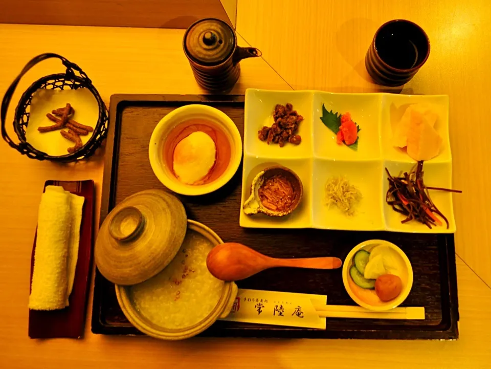 Snapdishの料理写真:Japanese Breakfast. Rice porridge with egg, natto, umeboshi, seafood and pickled side dishes.|Craig Colemanさん