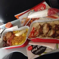 Snapdishの料理写真:Nasi kuning + hainam chicken boiled by air asia plane|Carol Limさん