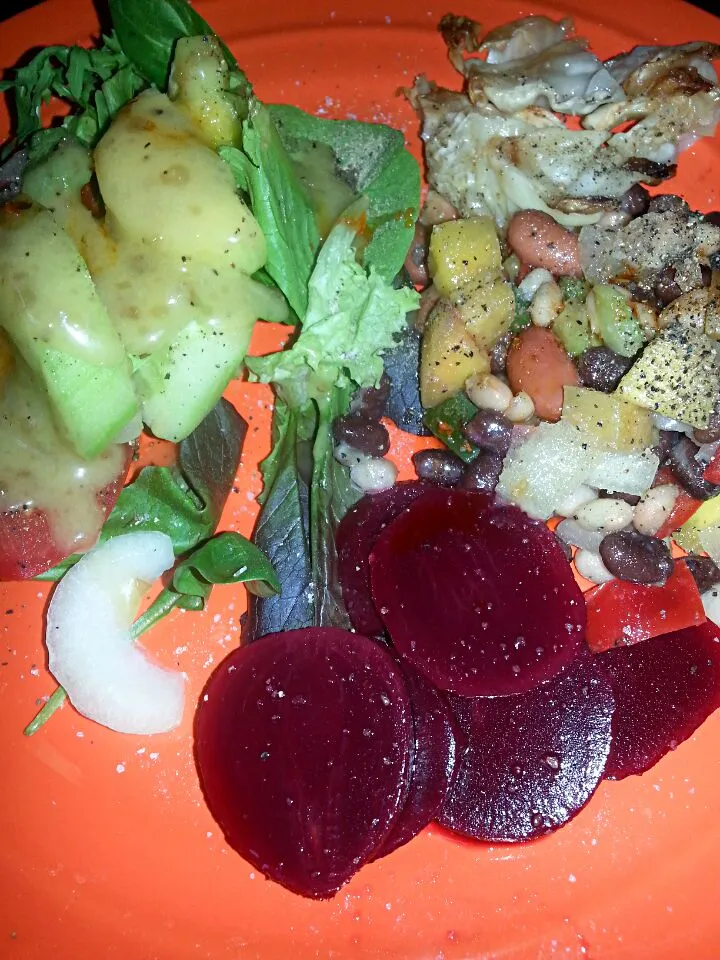 Snapdishの料理写真:mixed greens salad, beets, mango bean salad, and baked cabbage.|Polly Gelfusoさん