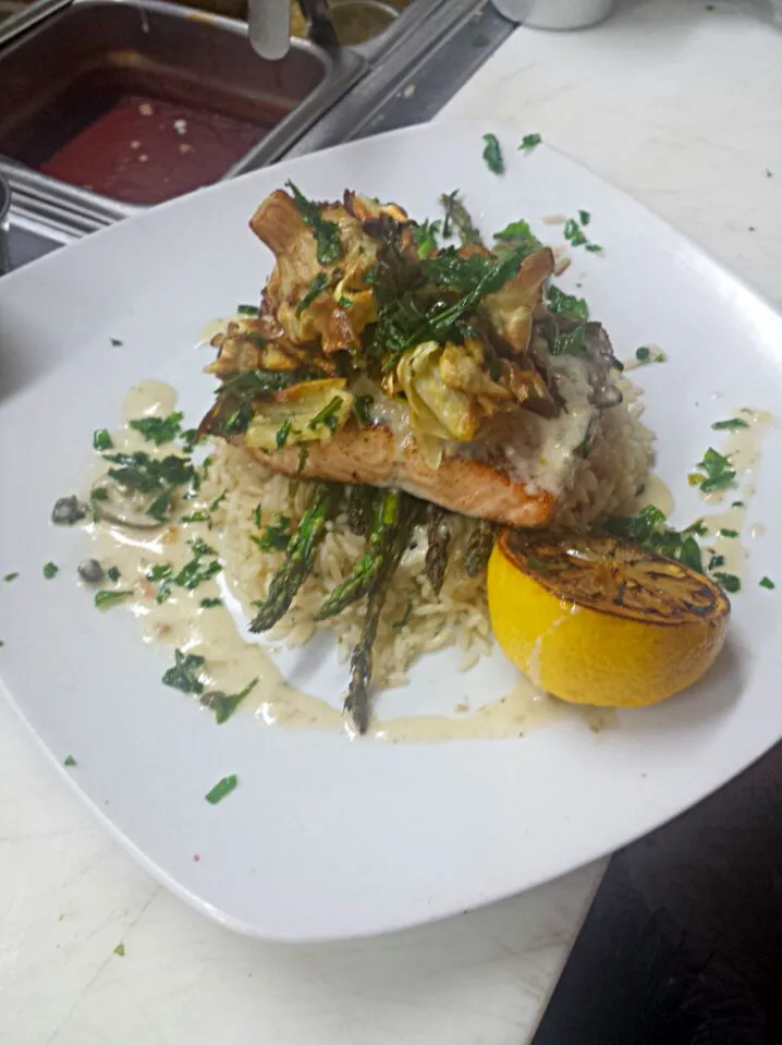 our salmon :) sitting on a bed of rice and asparagus with a white wine sauce and fried artichokes on top.|Steven Doportoさん