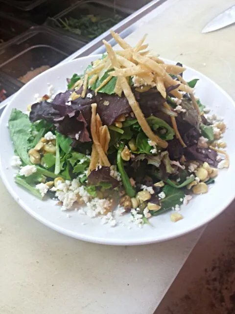 our house salad. fresh spring mix with chili roasted corn white cheese ;), and fried corn tortilla strips.|Steven Doportoさん