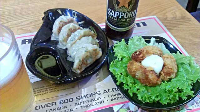 Snapdishの料理写真:The MOST I could get now in Saigon - Fried Oysters, Gyoza dumplings w/ Sapporo|Sean Jeongさん