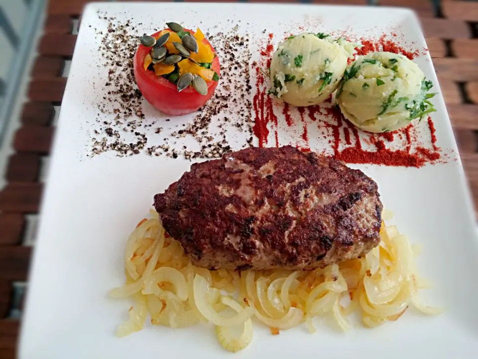 Beef rump steak (chopped by hand) on onion, fried in butter clarified, potato balls with herbs, stuffed tomato ...|Matthew NLさん