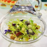 Salad served in a glass bottle