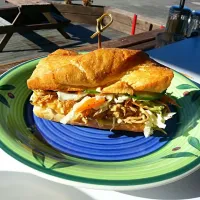 Pulled chicken sandwich with spicy slaw and housemade pickles|Stacy Dowさん