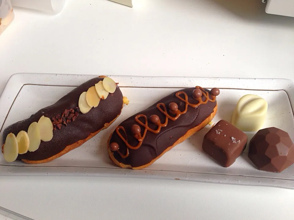 Assorted eclairs and truffles|Lauraさん