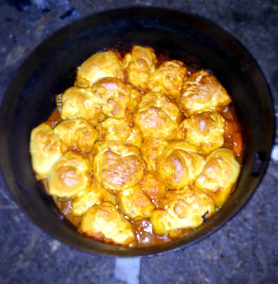 Beef and Guinness stew with dumplings cooked in a camp oven on a fire|woodfiredさん