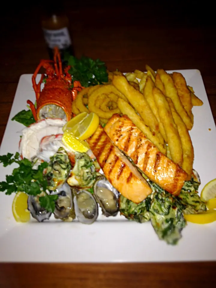 Home made seafood platter crayfish flathead fillets grilled salmon oysters calamari and chips|woodfiredさん