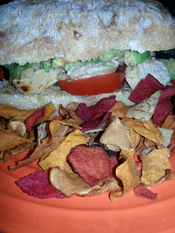 hubby sandwich.  garlic chibatta with various mUstard,  avocado,  tomato,  And mango marinated chix.  with chips.|Polly Gelfusoさん