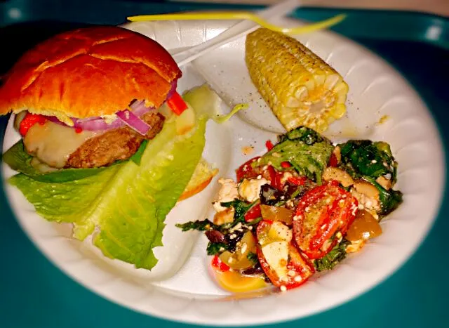 my daughter Shala made us a meal of Gourmet burger with swiss cheese a roasted peppers red onions tomato and Romain lettuce corn on the cob and tossed garden sa|christl babcockさん