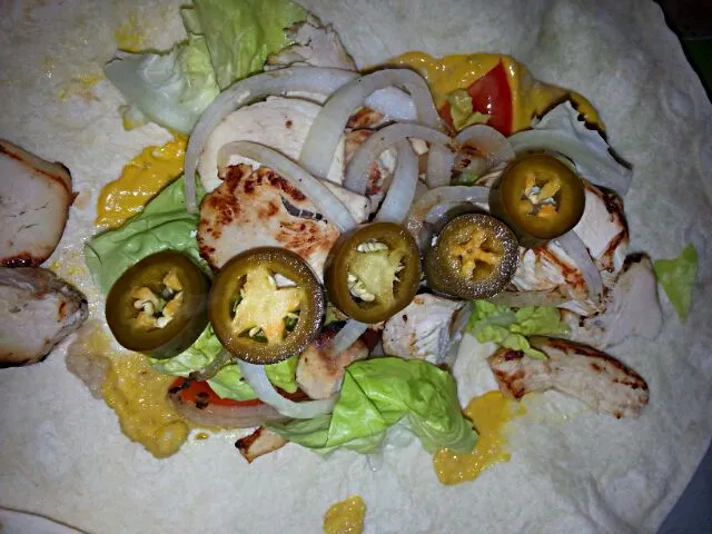 hubbies wrap.  sauteed grill chix and onion with lettuce, tomato, jalapeno mUstard&horseradish.|Polly Gelfusoさん