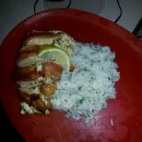 bacon wrapped chicken stuffed with pablanos caramelized onions roasted garlic and goat ch served with a cilantro lime rice .|Monique Whiteさん