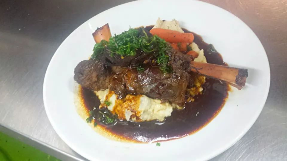 Snapdishの料理写真:our Dr . Pepper lamb braised shanks on top of yummy mash potatoes and covered in its own lamb sauce|Steven Doportoさん