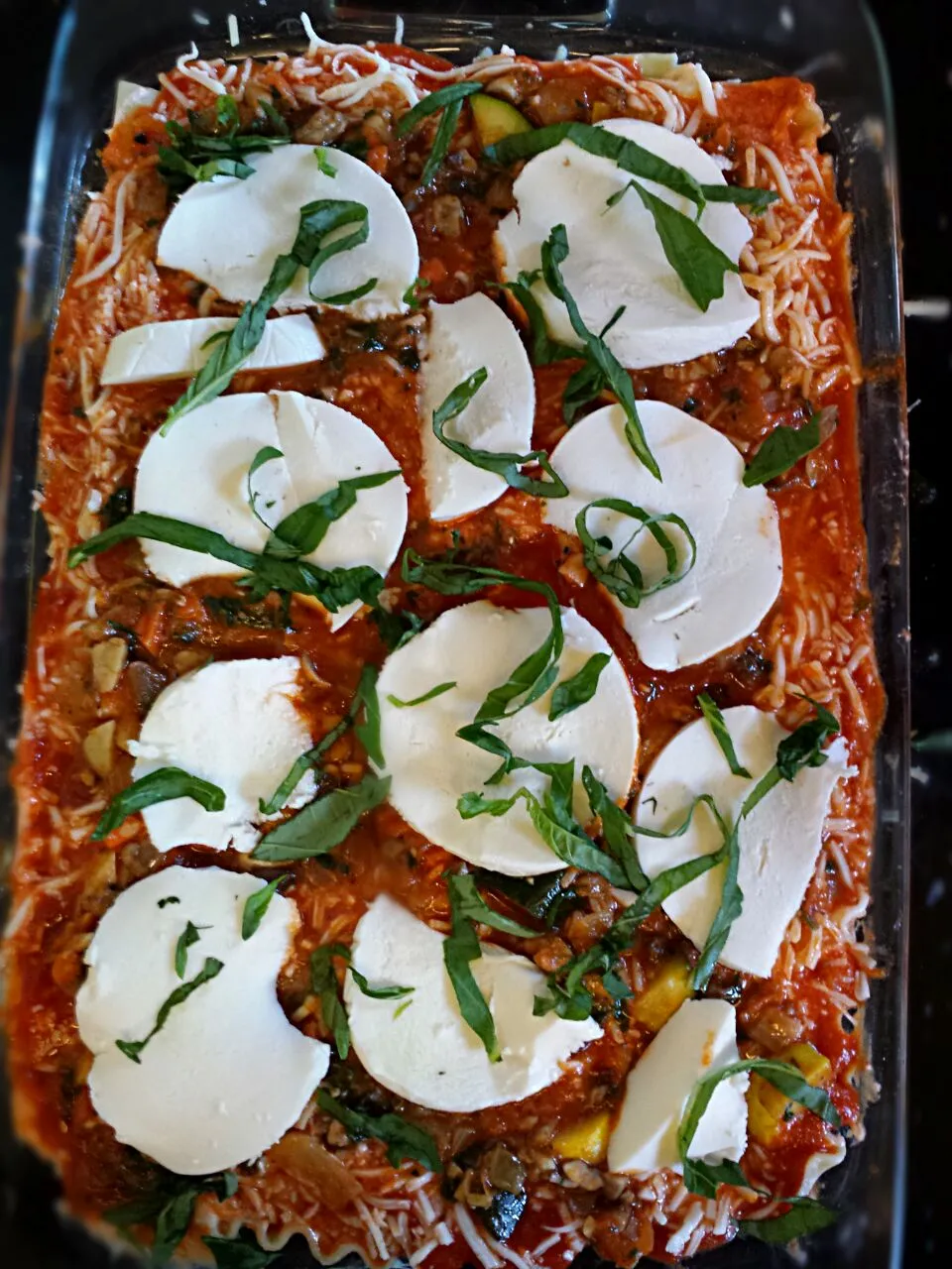 Snapdishの料理写真:home made veggie lasagna with zucchini,  yellow squash, spinach, onion, garlic,  mushrooms, carrots and tomatoes sauce with fresh mozzarella,  parmesan, and bas|Jillian Bittleさん