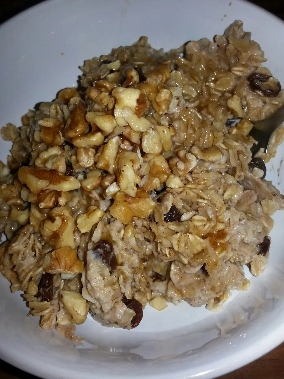 my dinner.  old fashioned oatmeal with Saigon cinnamon, raisins, walnuts, and maple syrup.|Polly Gelfusoさん