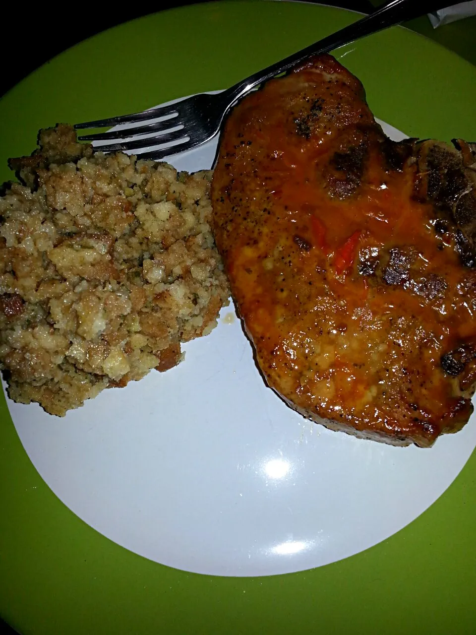 Snapdishの料理写真:Dinner for family.  Italian roasted pork chop with cheese and stuffing.  applesauce on the side too.|Polly Gelfusoさん