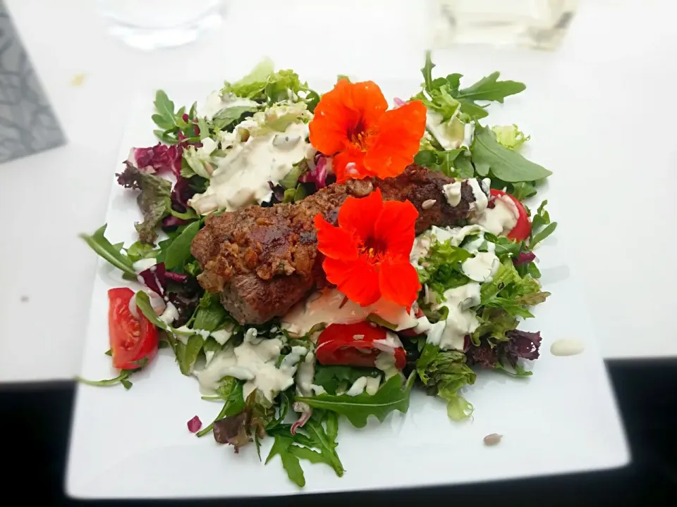 Pork sirloin marinated in red wine, on a salad with gorgonzola sauce...|Matthew NLさん