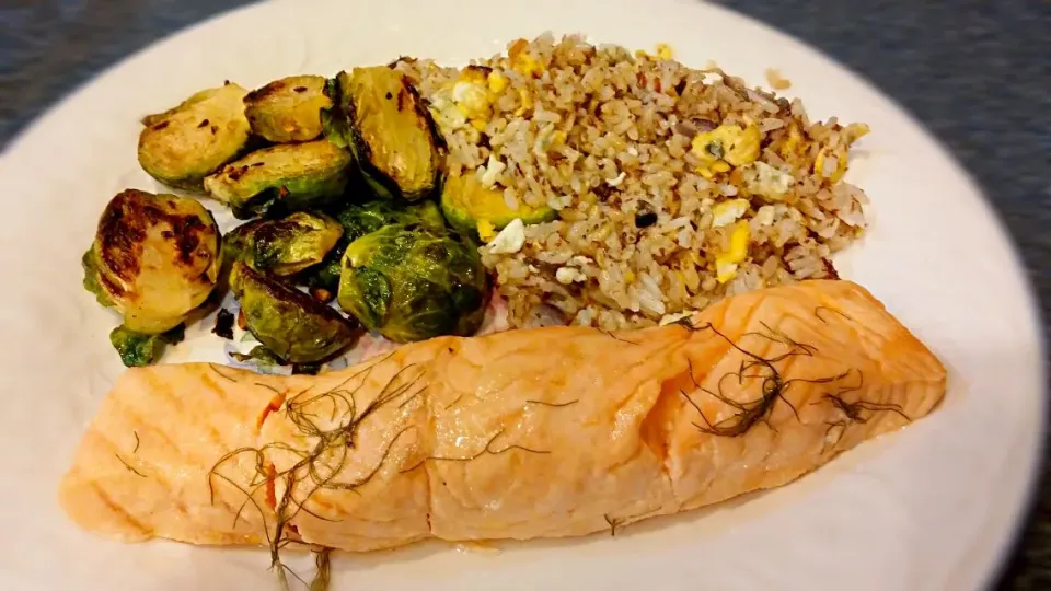 baked salmon with lemon butter frond, sauteed brussel sprouts and coconut/flaxseed fried rice.|Jiraphon Gさん