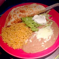 Chicken quesadillas with Mexican rice ,beans, guacamole,sour cream,lettuce,and cheese|angela johnsonさん