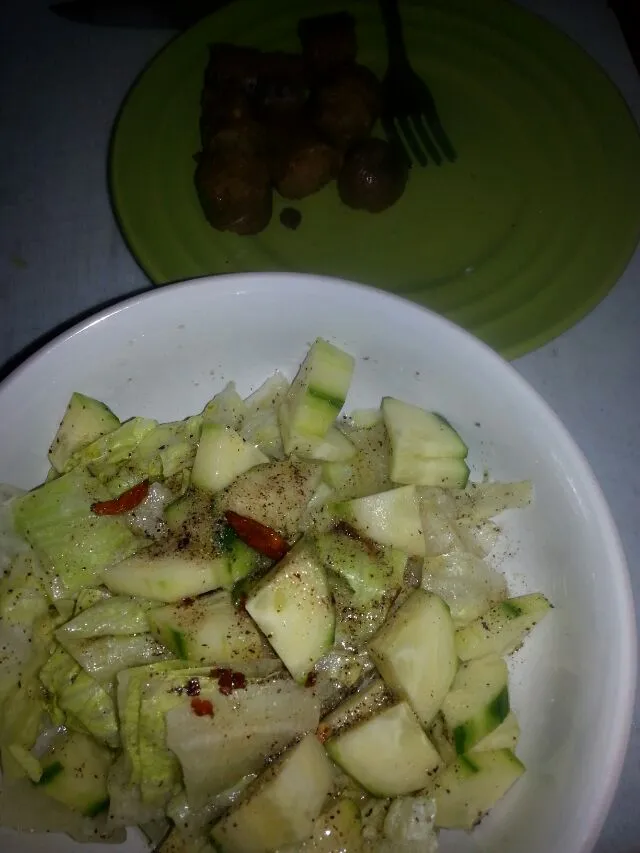 simple salad with lettuce and cucumbers.  dressed in tarragon vinegar,  s&p, chili oil, and my new obsession white truffle oil.  And a sausage.|Polly Gelfusoさん