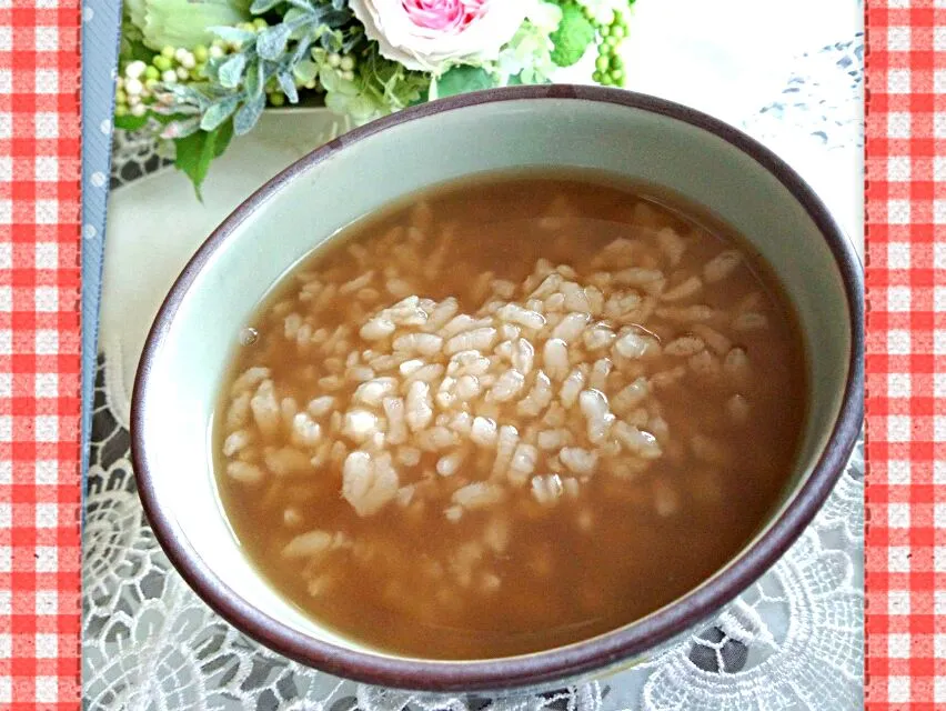 Snapdishの料理写真:和歌山県の郷土料理〖茶粥〗
我が家は麦茶でたきますのよ～♪
夏になるとおかいさん(←方言）と茄子と胡瓜のぬか漬けあれば最高の食事だったり…。|mami86さん