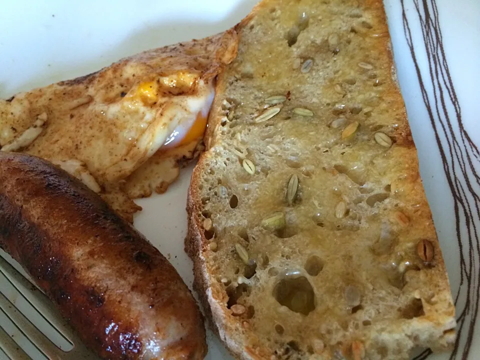 Spicy Italian sausage and sunny side up egg with homemade bread|Ong Sor Fernさん